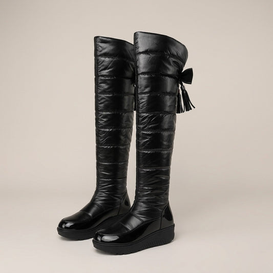 Adeline black glossy quilted tall boots with a bow-tassel back detail, pair