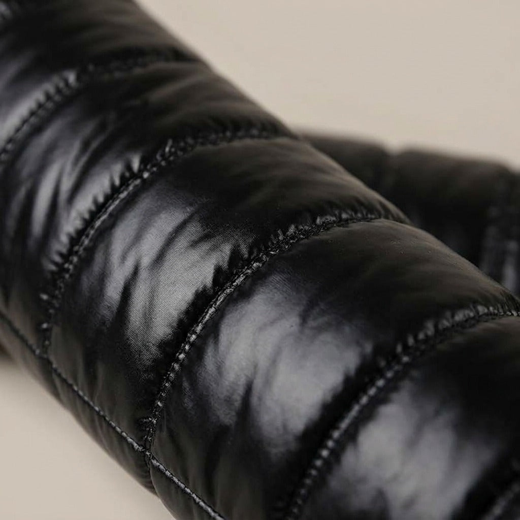 Close-up of the glossy quilted shaft on the Adeline boot