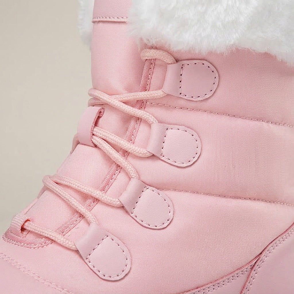 Close-up of the lace loops and white plush cuff on the Birdie boot