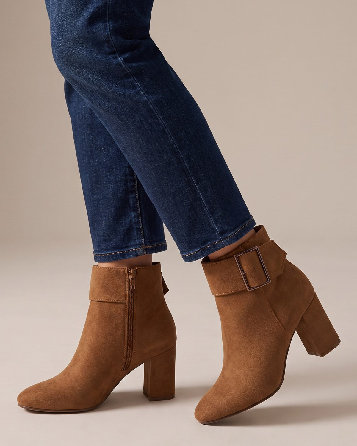 Briar brown ankle boots worn with jeans, studio shot of legs