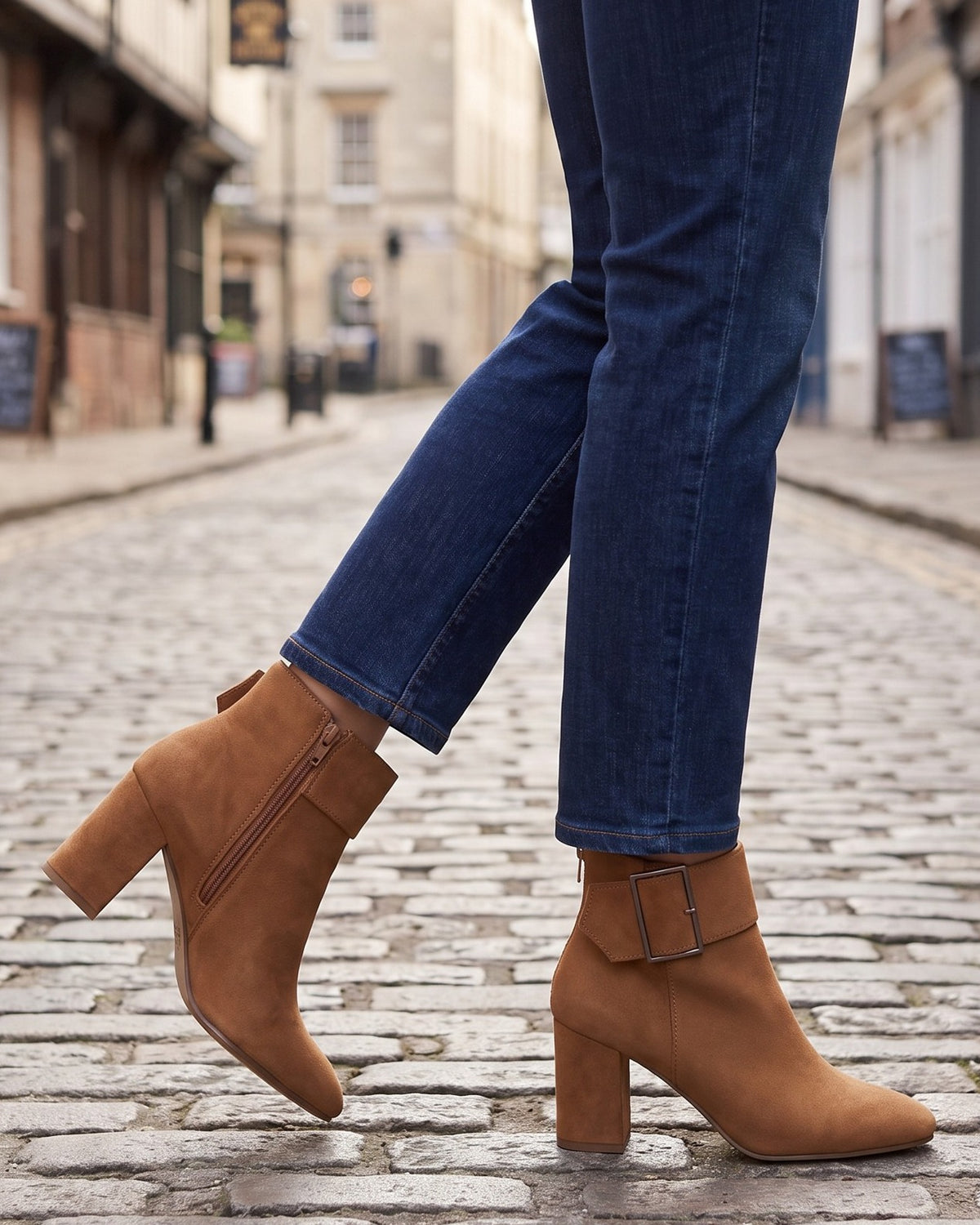 Briar brown ankle boots worn with jeans on a cobblestone street