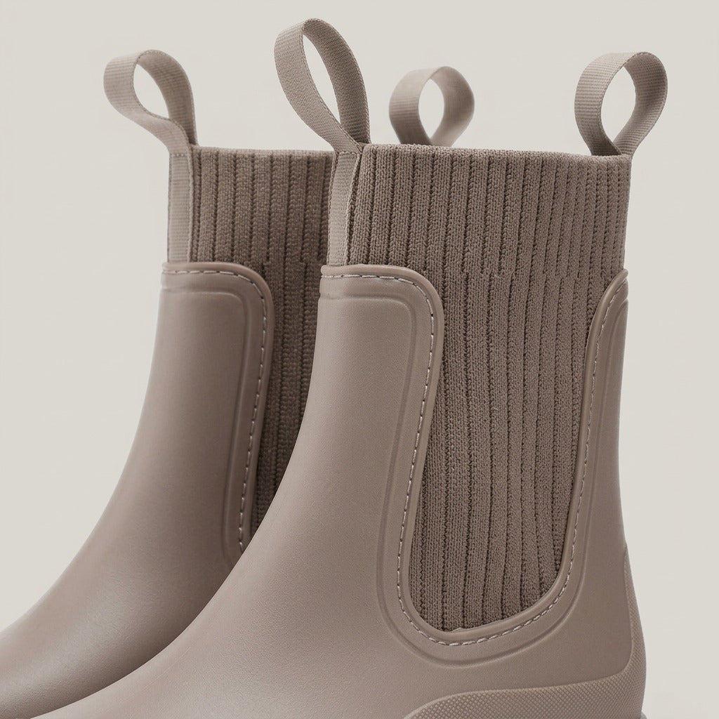 Close-up of the ribbed knit panel and pull loops on the Clover boot