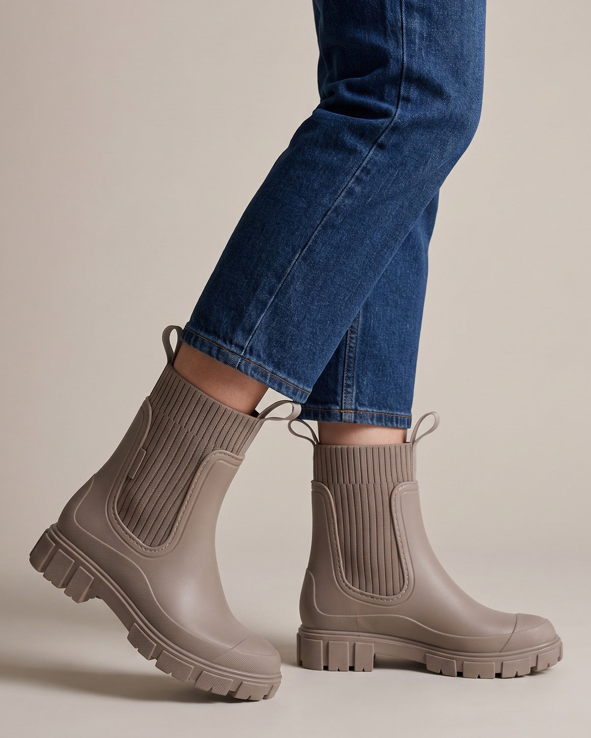 Clover taupe chelsea boots worn with jeans, studio shot of legs