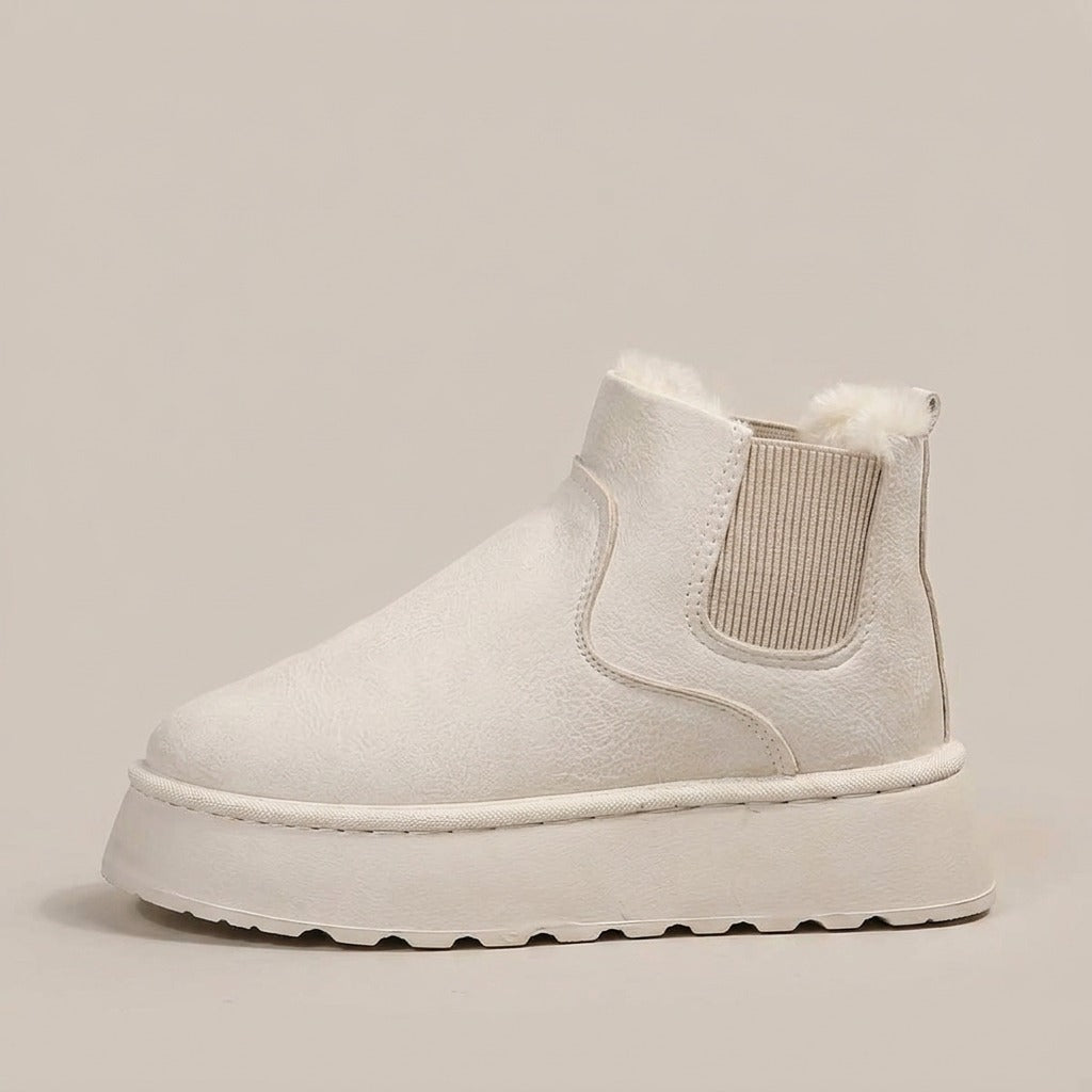 Coral cream snow boot, side view of the platform sole