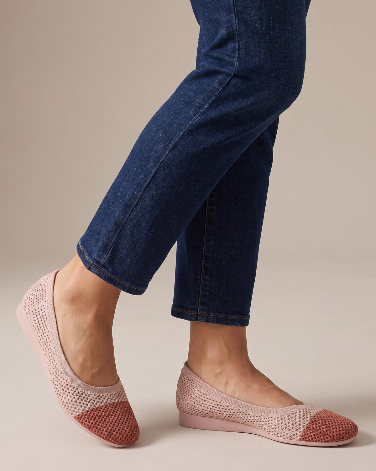 Elsie two-tone knit flats worn with jeans, studio shot of legs