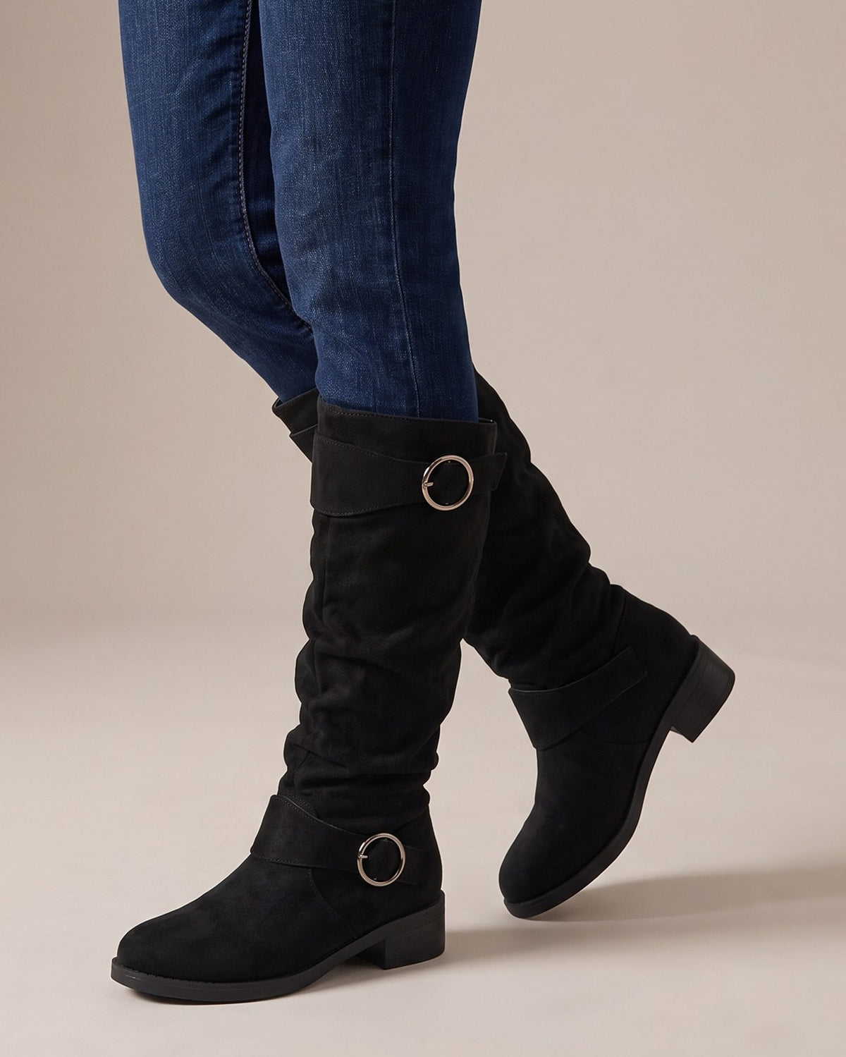Esme slouch boots worn with jeans, studio shot of legs