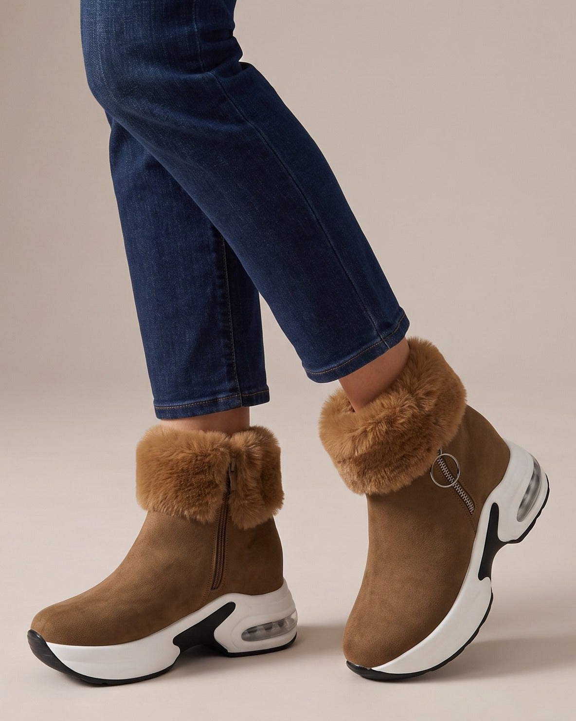 Flora camel boots worn with jeans, studio shot of legs