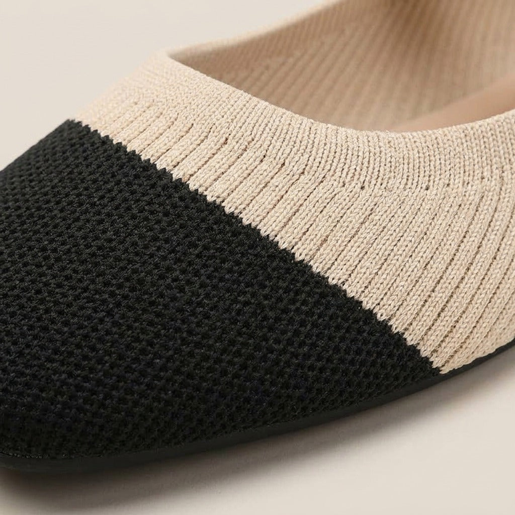 Close-up of the black cap toe and beige knit on the Greta flat
