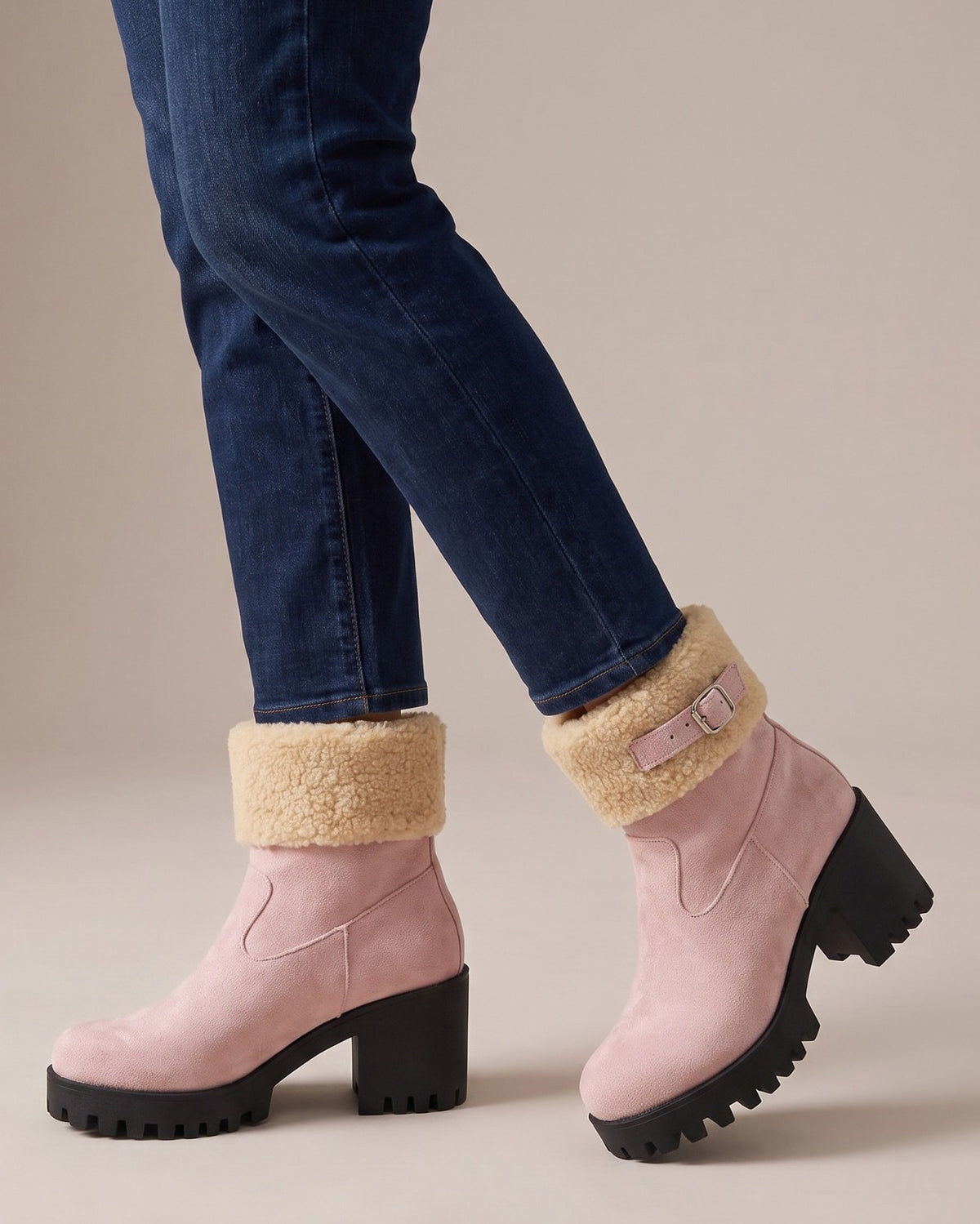 Gwen pink ankle boots worn with jeans, studio shot of legs