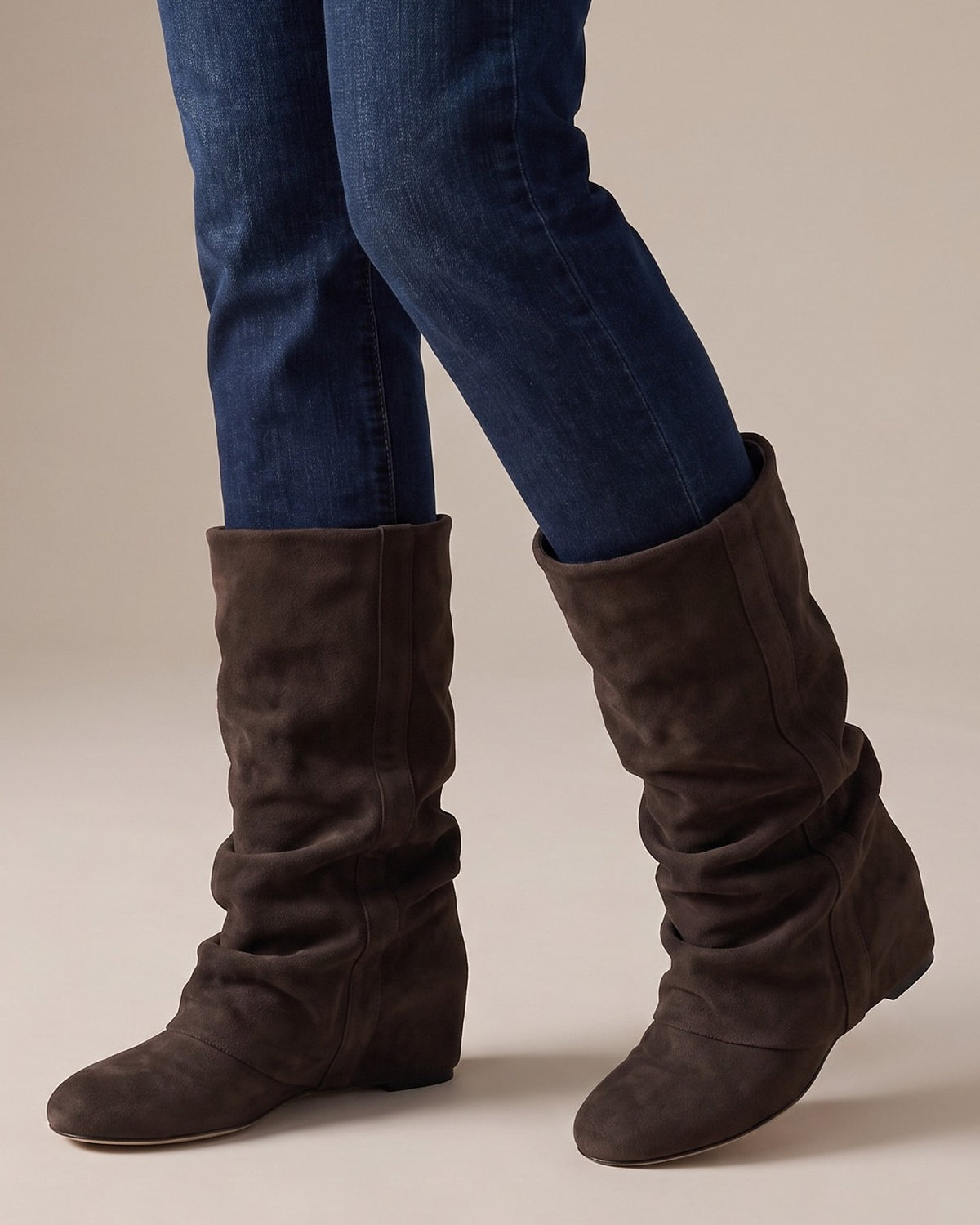 Hattie slouch boots worn with jeans, studio shot of legs