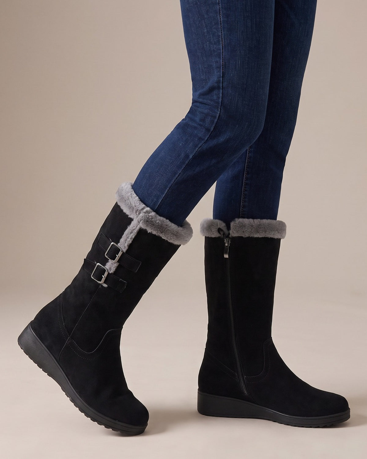Ida black boots worn with jeans, studio shot of legs