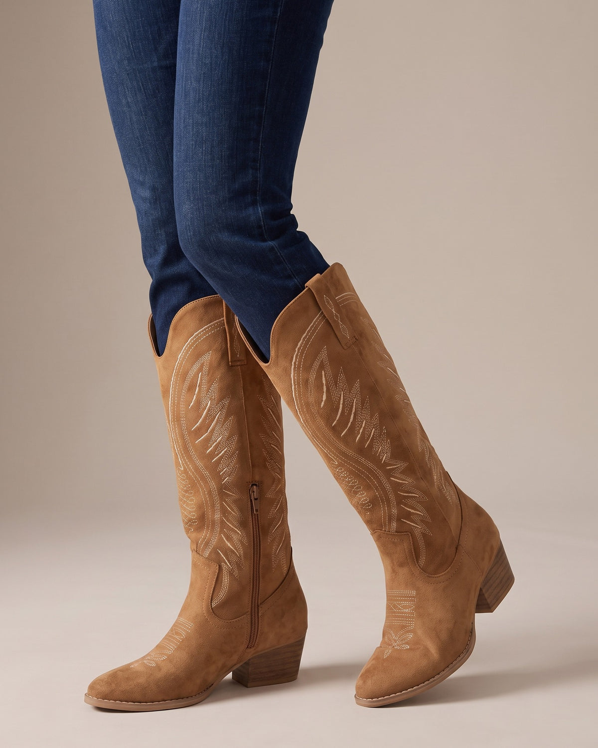 Imogen tan western boots worn with jeans, studio shot of legs