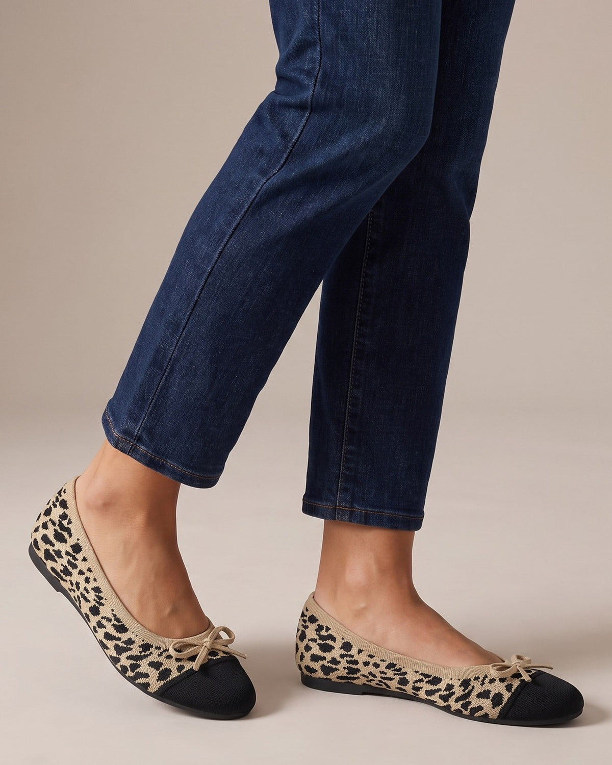 Isla leopard knit flats worn with jeans, studio shot of legs