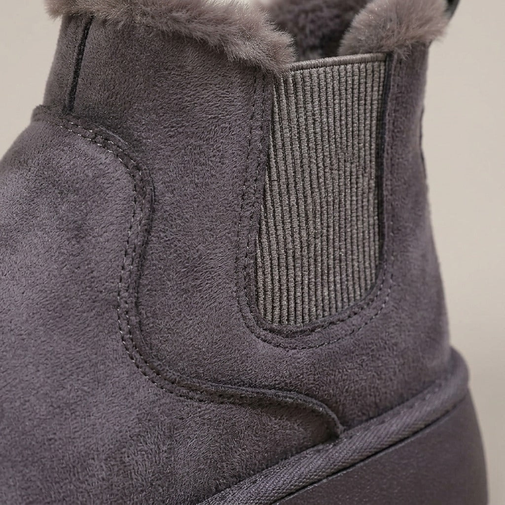 Close-up of the elastic side panel and plush collar on the Ivy boot