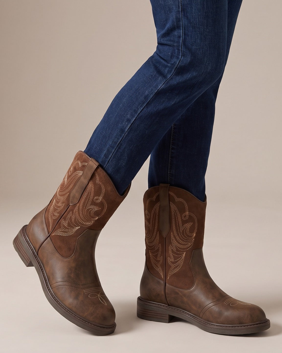 Juliet brown western boots worn with jeans, studio shot of legs
