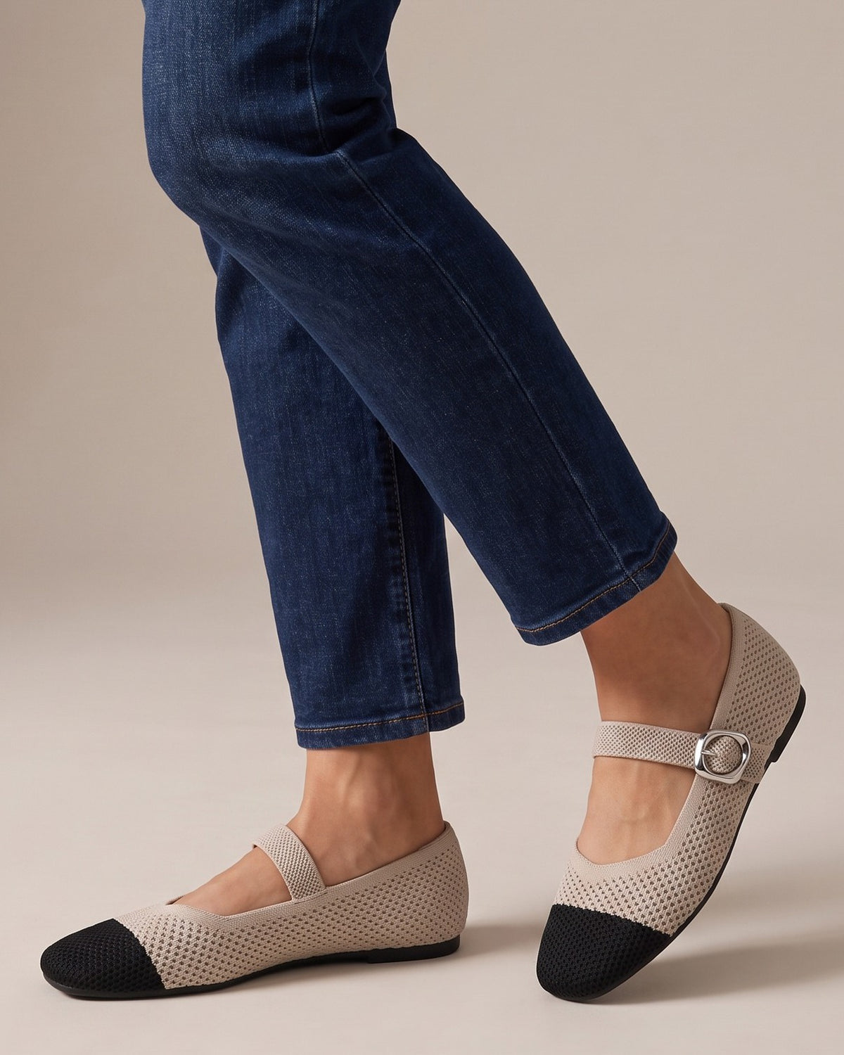 Nina cap-toe Mary Janes worn with jeans, studio shot of legs