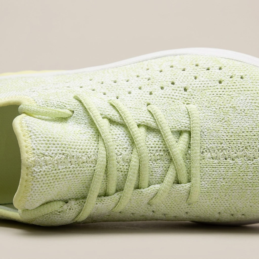 Close-up of the perforated knit upper and flat laces on the Pippa trainer
