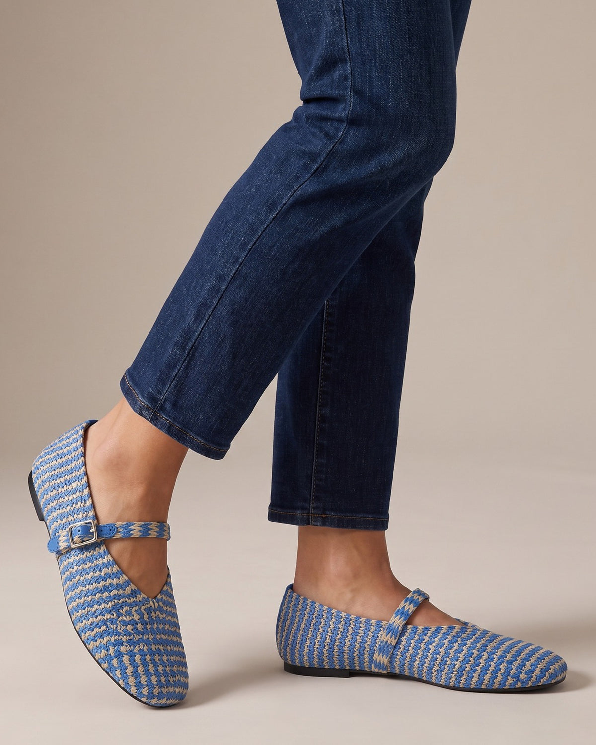 Poppy striped Mary Janes worn with jeans, studio shot of legs