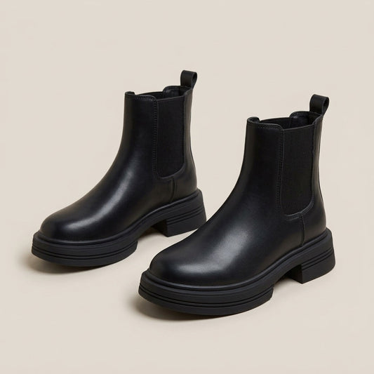 Quinn black chelsea boots with elastic side panels and chunky sole, pair