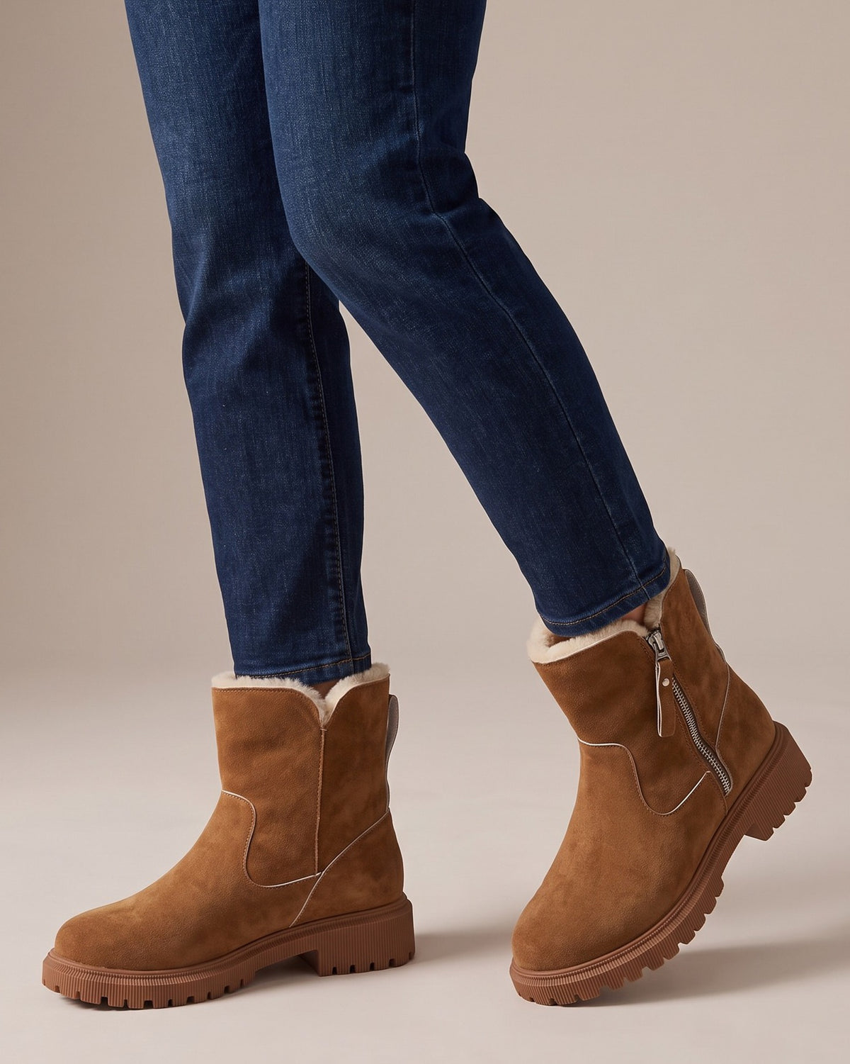 Simone brown ankle boots worn with jeans, studio shot of legs