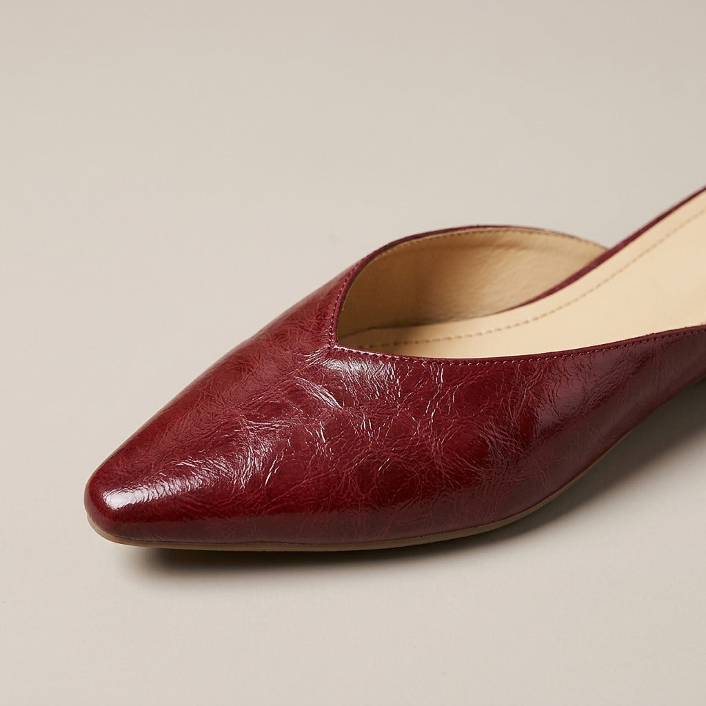 Close-up of the pointed toe and crinkled glossy finish on the Thea mule