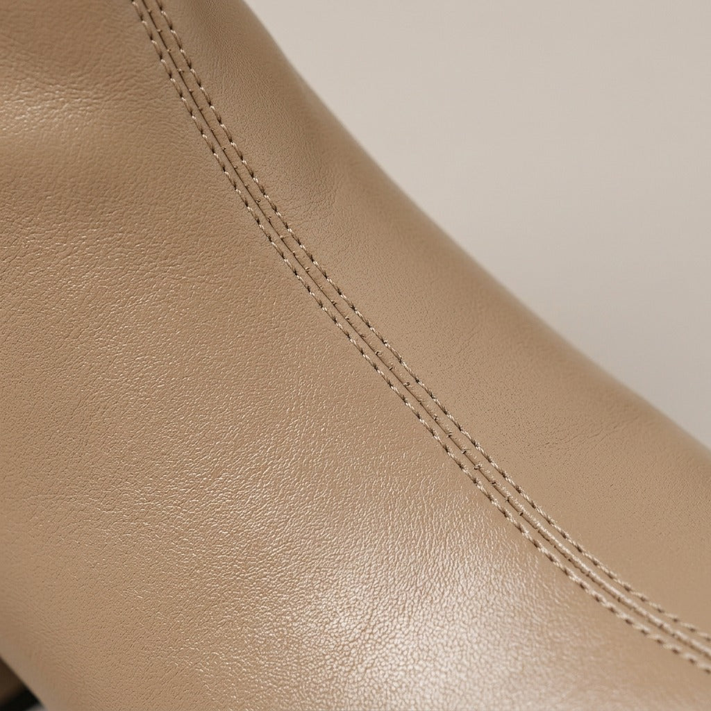 Close-up of the smooth khaki upper and seam on the Tilly boot