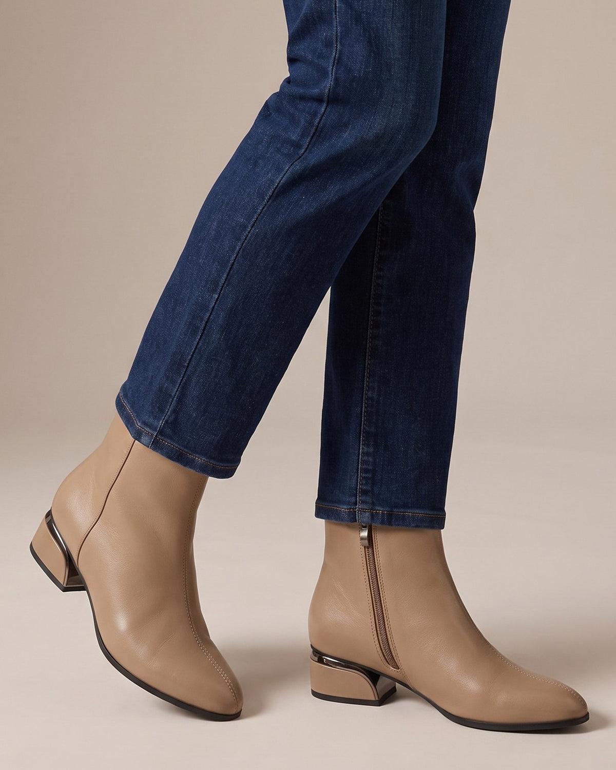 Tilly khaki ankle boots worn with jeans, studio shot of legs