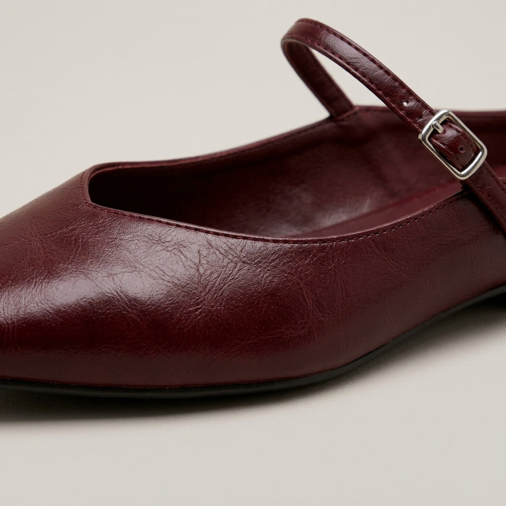 Close-up of the buckle strap and glossy finish on the Verity mule