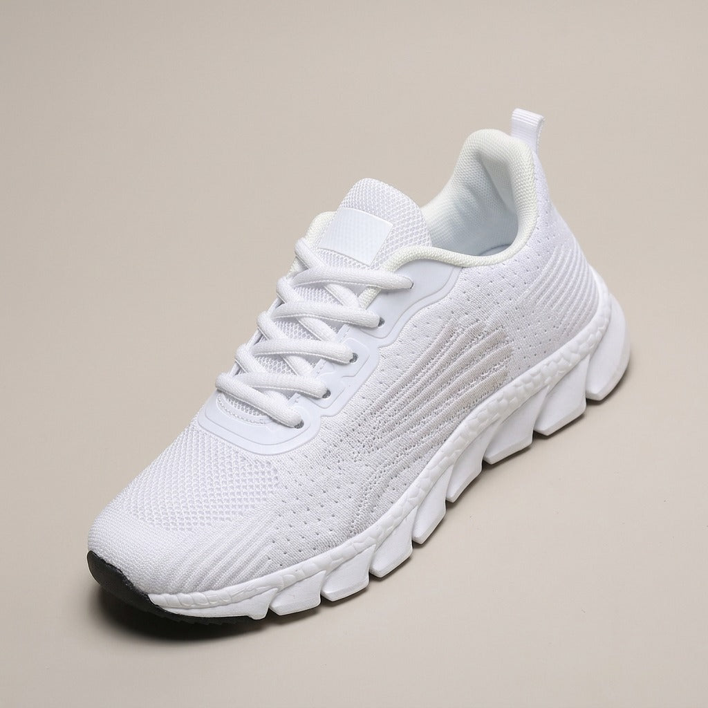 Wren white knit lace-up sneaker with a thick white sole, three-quarter view