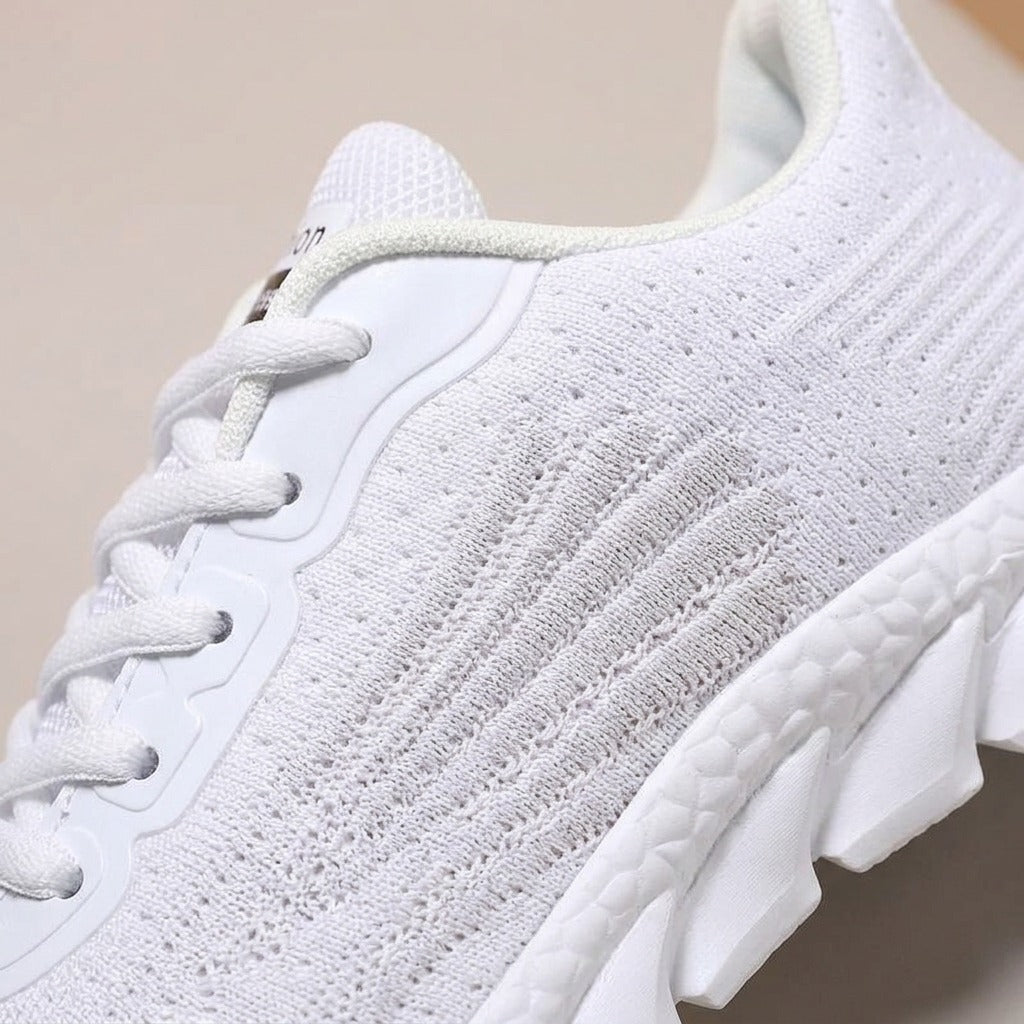 Close-up of the ribbed knit side and thick sole on the Wren sneaker